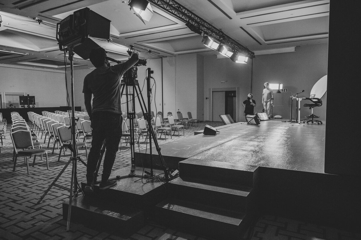 Nitesh operating a camera rig on a live stage setup, Barcelona