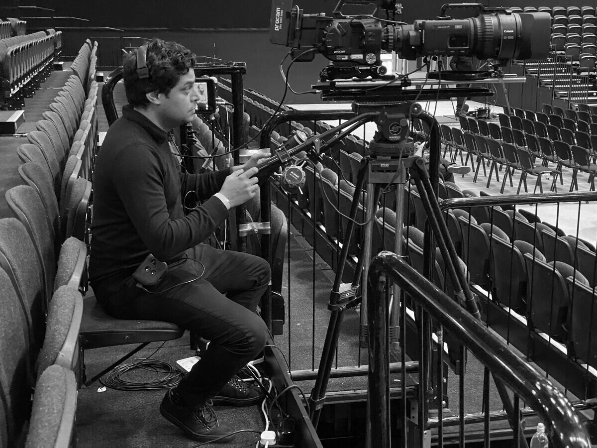 Nitesh operating the main camera on a corporate event