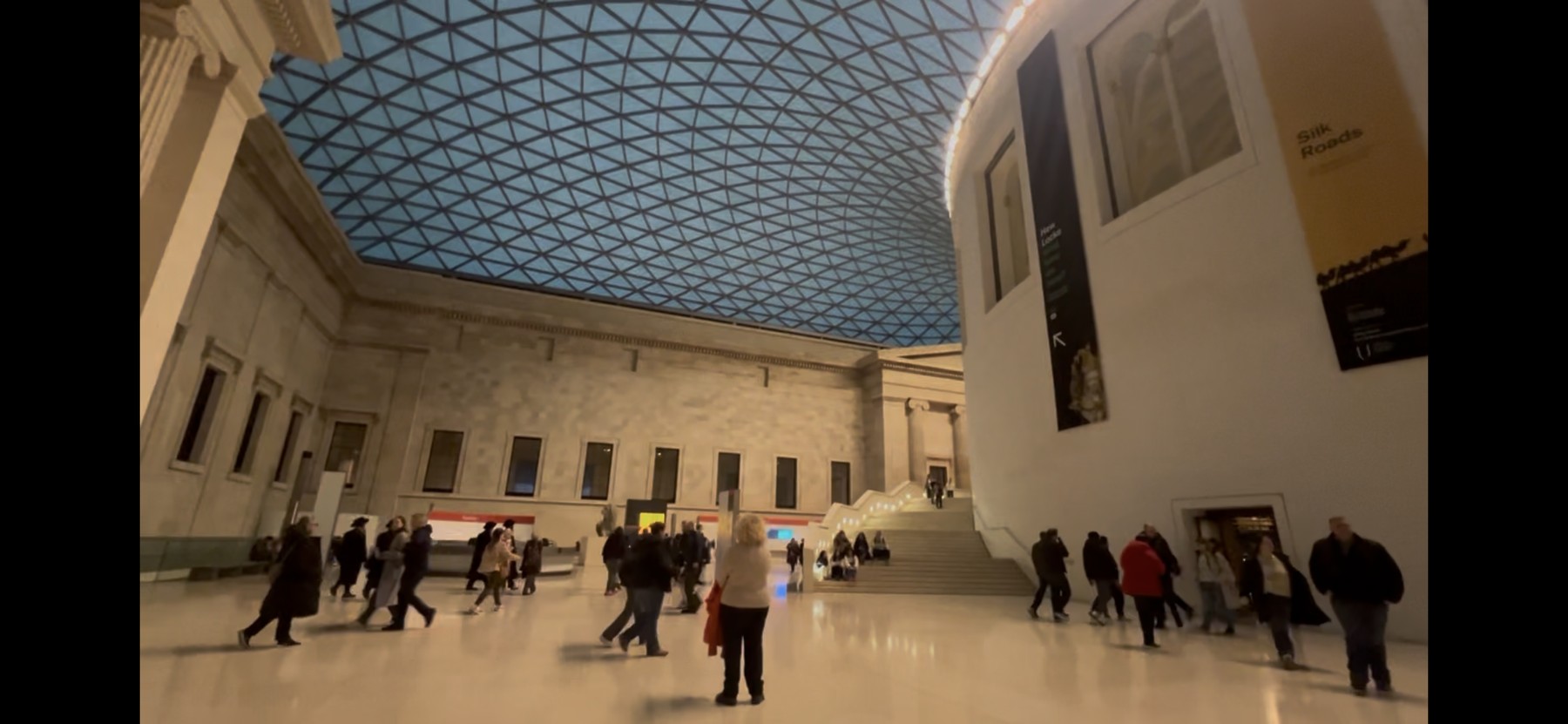 Visitors beneath the glass roof of the British Museum's Great Court, London