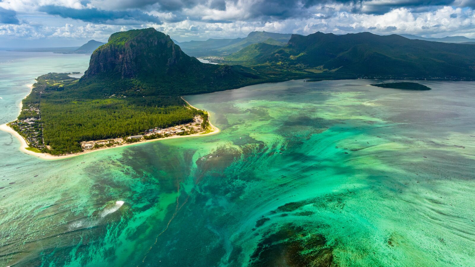 Aerial drone photograph of Le Morne, Mauritius, showing the underwater waterfall optical illusion