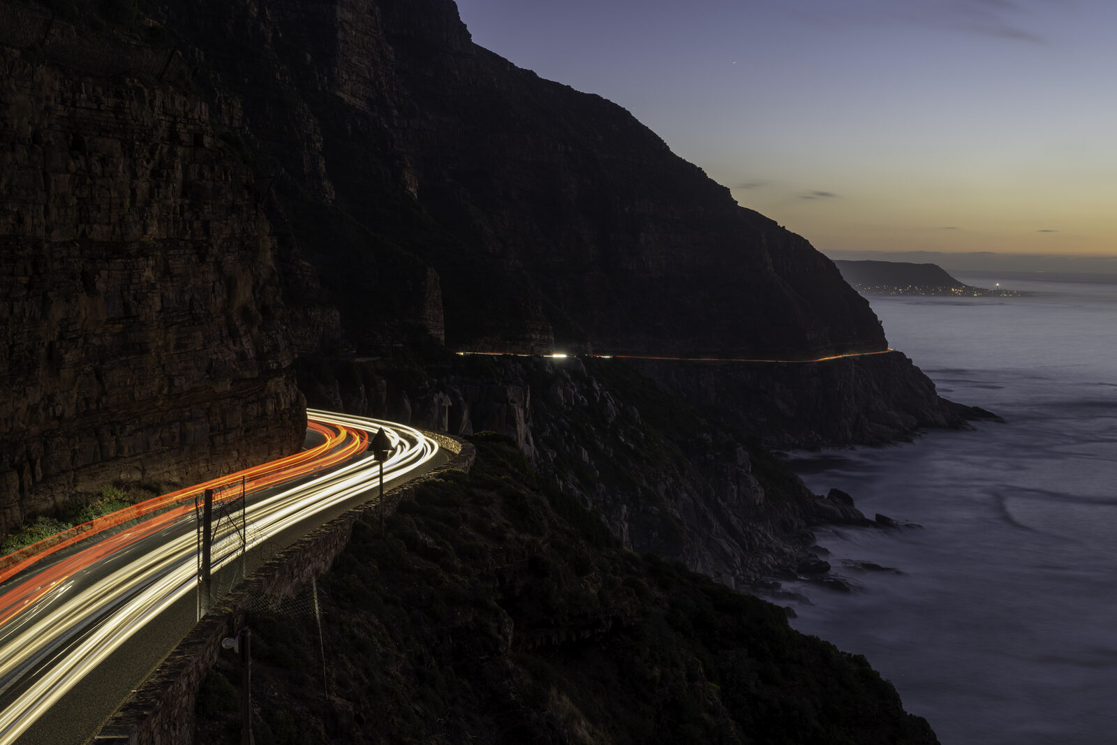 Aerial drone photograph of Chapman's Peak Drive at dusk, Cape Town